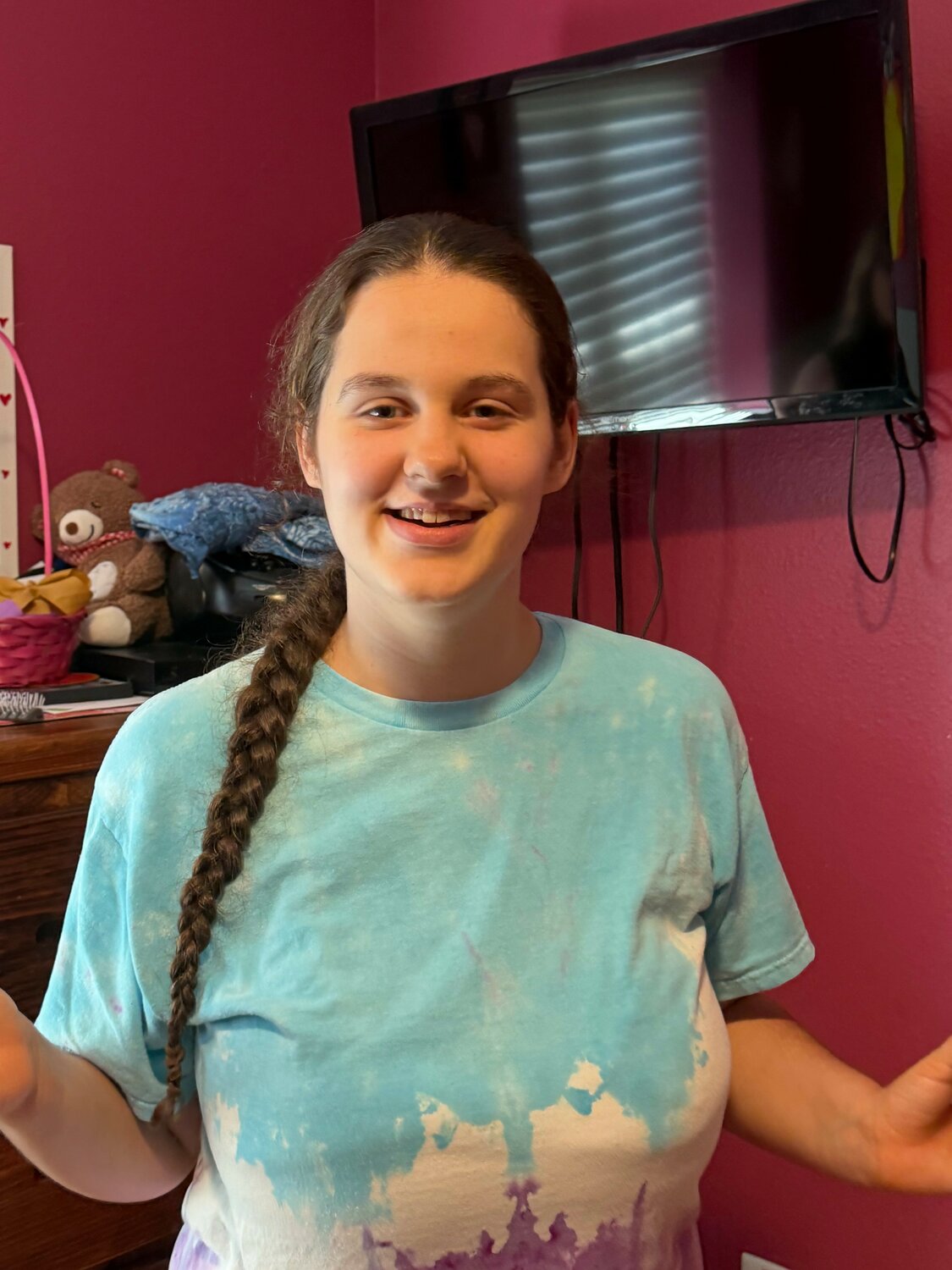 Amy Bateman smiles during a portrait for her Sunshine Communities resident story, celebrating her experiences and connections within the community.