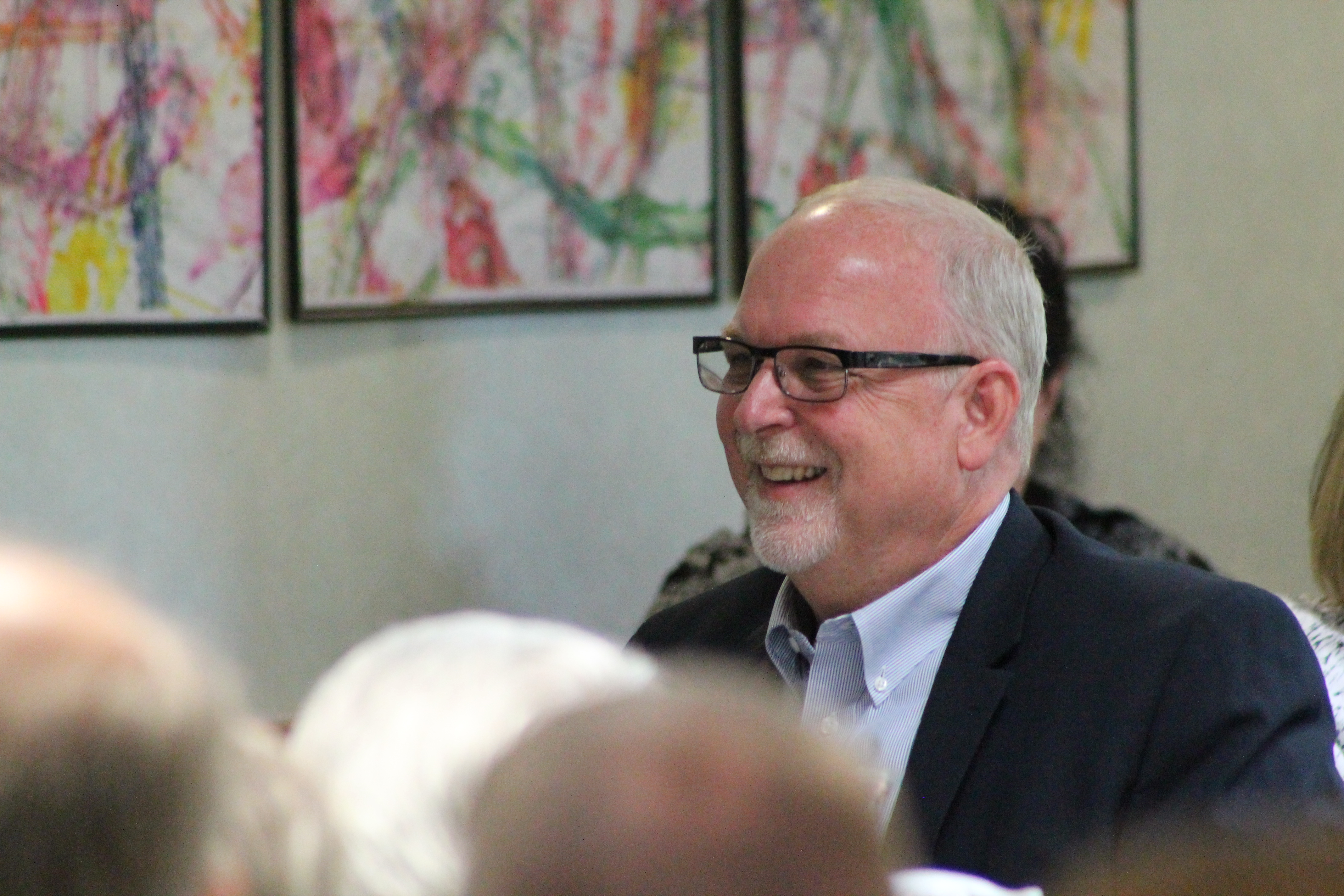 Luther Gautsche smiling while attending an event.