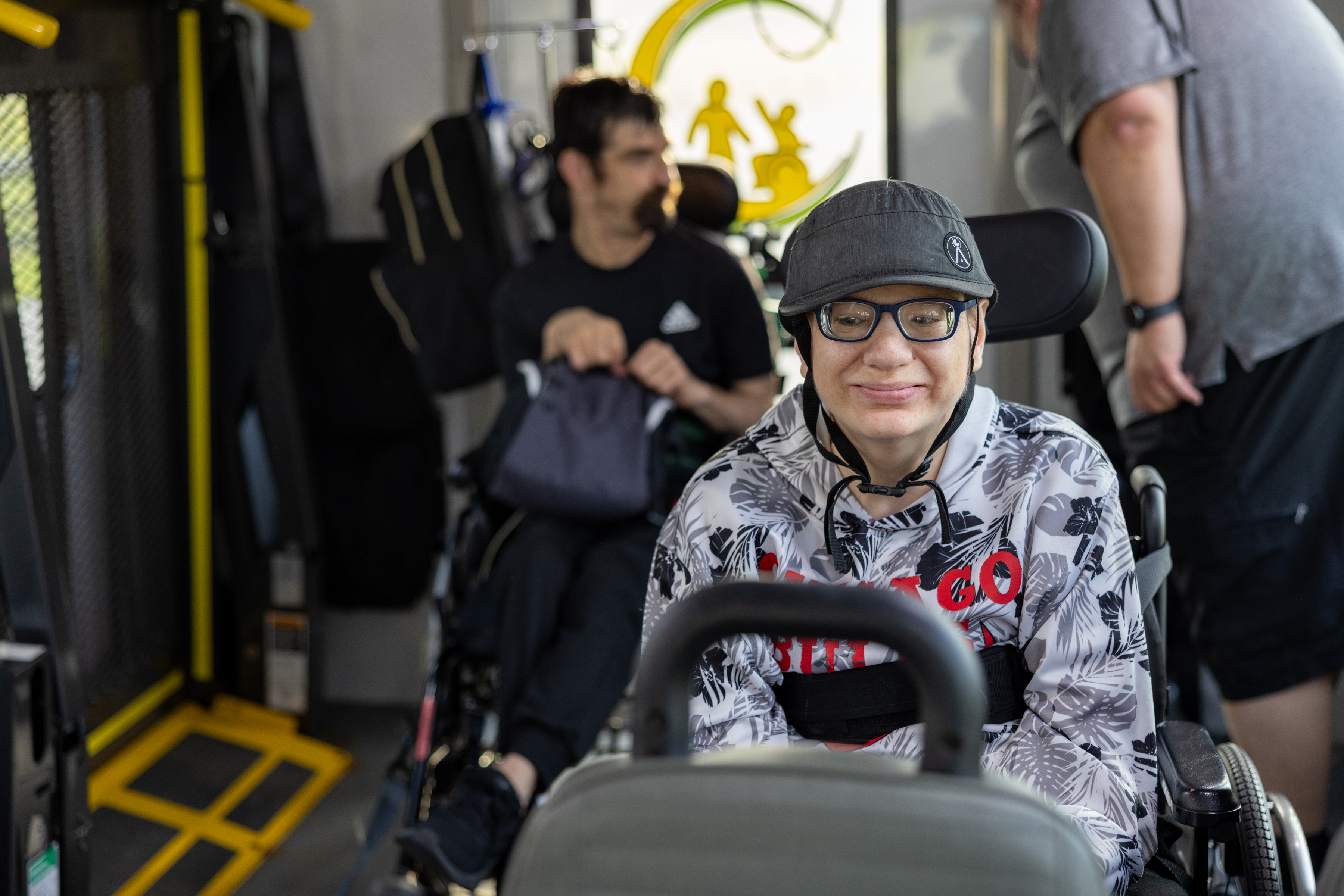 A person smiling in a Sunshine bus