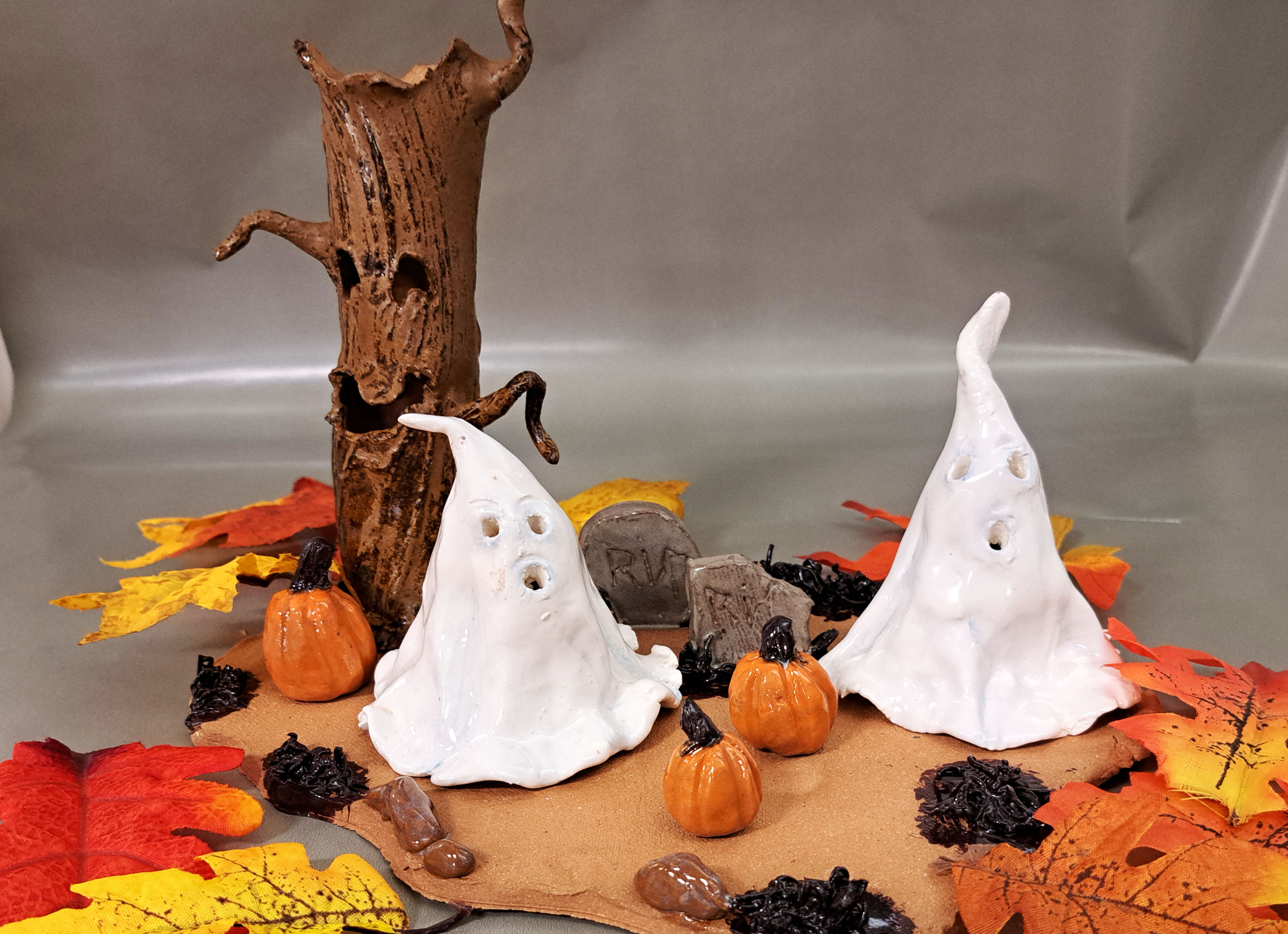 A charming ghost figurine designed for Halloween, featuring a playful design that adds a spooky yet fun touch to decor.