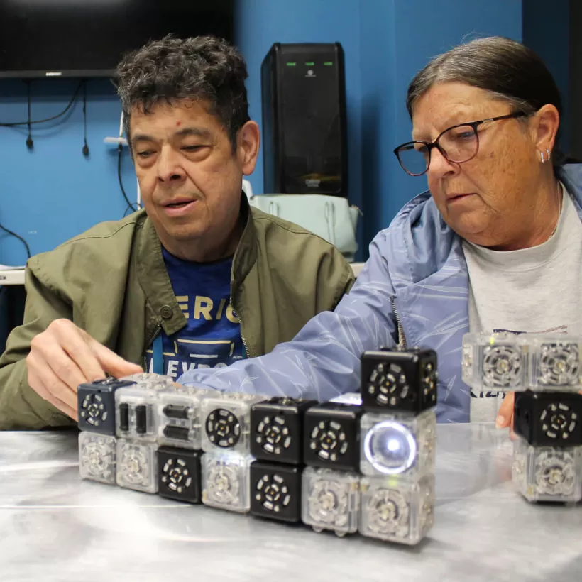 People Building with Mechanical Blocks