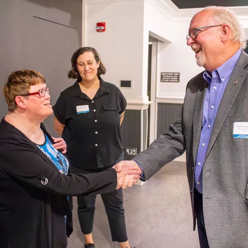 Two People Shaking Hands