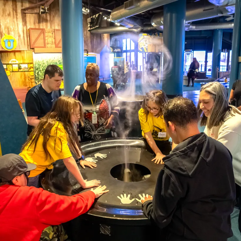 Individuals from Sunshine Communities participate in a hands-on science activity at Imagination Station in Toledo, Ohio during Developmental Disabilities Awareness Month.
