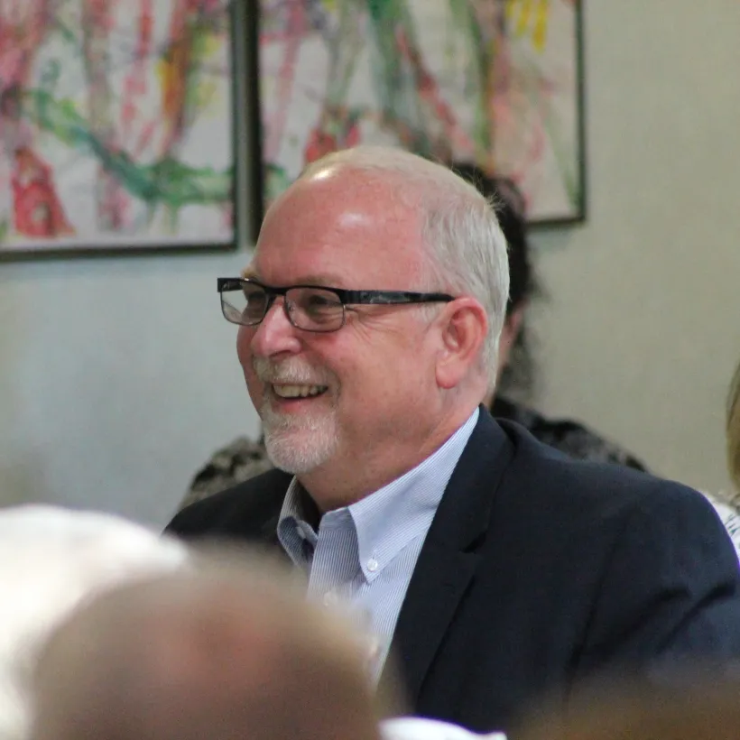 Luther Gaustche, a Sunshine board member smiling 